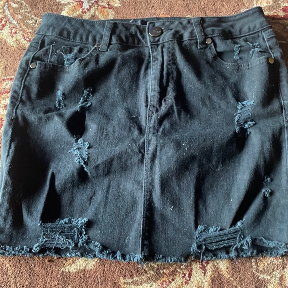 Distressed black denim skirt